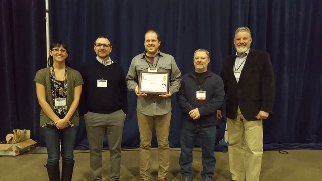 Andrew J Dennhardt receives the Janice Lee Fenske Memorial Award in the Wildlife Professional category